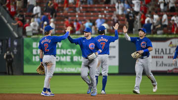 Jul 12, 2024; St. Louis, Missouri, USA;  Chicago Cubs left fielder Ian Happ (8) second baseman Nico Hoerner (2) shortstop Dansby Swanson (7) and right fielder Seiya Suzuki (27) celebrate after the Cubs defeated the St. Louis Cardinals at Busch Stadium.