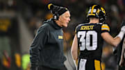 Nov 29, 2024; Iowa City, Iowa, USA; Iowa Hawkeyes head coach Kirk Ferentz reacts as defensive back Quinn Schulte (30) looks on during the first quarter against the Nebraska Cornhuskers at Kinnick Stadium.