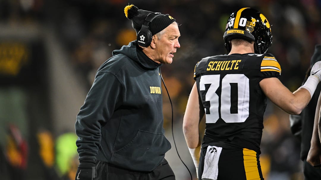 Nov 29, 2024; Iowa City, Iowa, USA; Iowa Hawkeyes head coach Kirk Ferentz reacts as defensive back Quinn Schulte (30) looks on during the first quarter against the Nebraska Cornhuskers at Kinnick Stadium. Mandatory Credit: Jeffrey Becker-Imagn Images