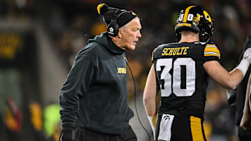 Nov 29, 2024; Iowa City, Iowa, USA; Iowa Hawkeyes head coach Kirk Ferentz reacts as defensive back Quinn Schulte (30) looks on during the first quarter against the Nebraska Cornhuskers at Kinnick Stadium. Mandatory Credit: Jeffrey Becker-Imagn Images
