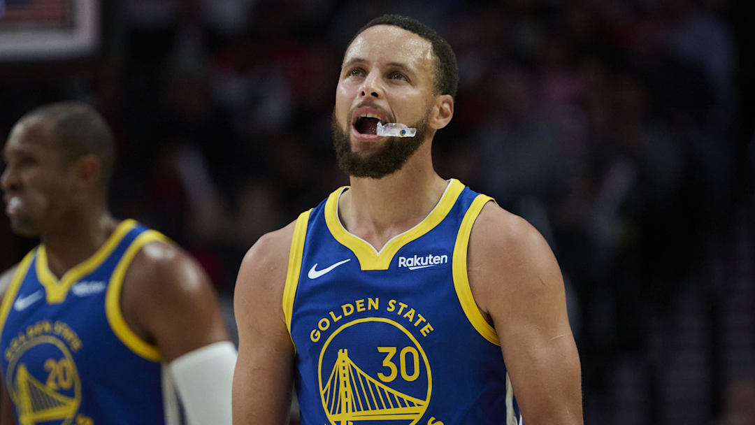 Oct 14, 2025; Portland, Oregon, USA; Golden State Warriors guard Stephen Curry (30) looks up a the scoreboard during the second half against the Portland Trail Blazers at Moda Center. Mandatory Credit: Troy Wayrynen-Imagn Images