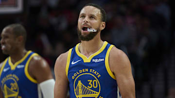 Oct 14, 2025; Portland, Oregon, USA; Golden State Warriors guard Stephen Curry (30) looks up a the scoreboard during the second half against the Portland Trail Blazers at Moda Center. Mandatory Credit: Troy Wayrynen-Imagn Images