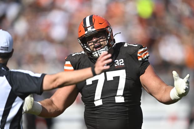 Offensive guard talks to official after a flag.