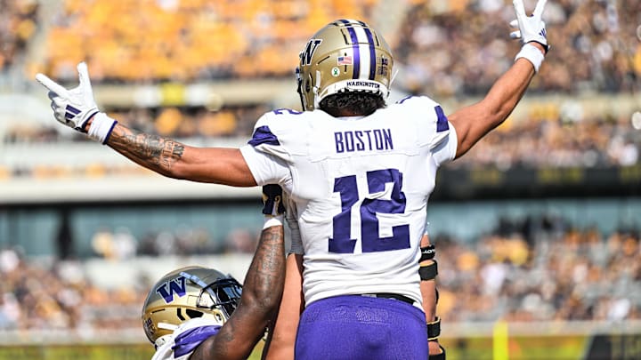 Oct 12, 2024; Iowa City, Iowa, USA; Washington Huskies wide receiver Denzel Boston (12) reacts after catching a touchdown pass during the second quarter against the Iowa Hawkeyes at Kinnick Stadium. Mandatory Credit: Jeffrey Becker-Imagn Images