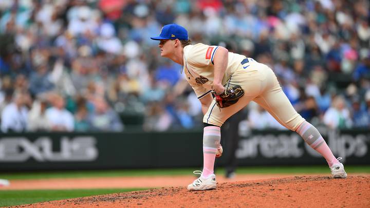 May 11, 2025; Seattle, Washington, USA; Seattle Mariners relief pitcher Troy Taylor (59) looks for a pitch sign during the eighth inning against the Toronto Blue Jays at T-Mobile Park. Mandatory Credit: Steven Bisig-Imagn Images