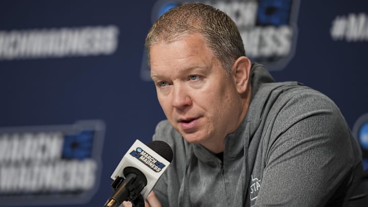Mar 19, 2025; Lexington, KY, USA;  Utah State head coach Jerrod Calhoun talks with media during NCAA Tournament First Round Practice at Rupp Arena. Mandatory Credit: Aaron Doster-Imagn Images