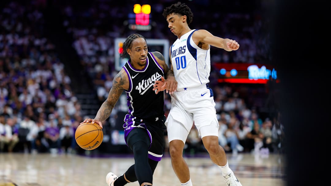 Apr 16, 2025; Sacramento, California, USA; Sacramento Kings forward DeMar DeRozan (10) dribbles the ball against Dallas Mavericks guard Max Christie (00) during the fourth quarter at Golden 1 Center. Mandatory Credit: Sergio Estrada-Imagn Images Apr 16, 2025; Sacramento, California, USA; Sacramento Kings forward DeMar DeRozan (10) dribbles the ball against Dallas Mavericks guard Max Christie (00) during the fourth quarter at Golden 1 Center. Mandatory Credit: Sergio Estrada-Imagn Images