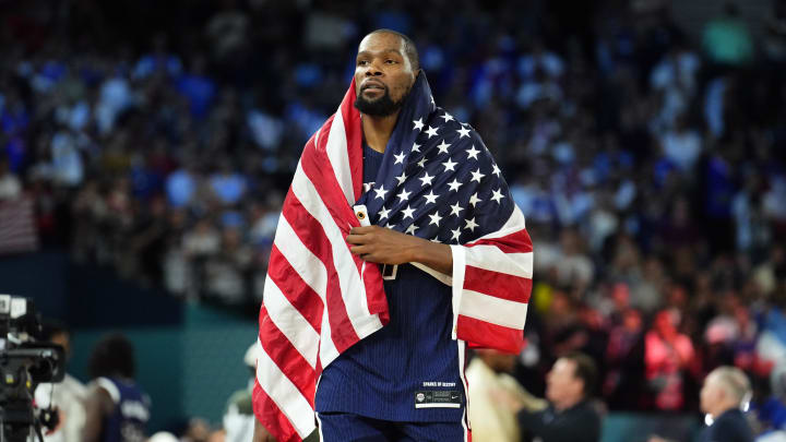 Aug 10, 2024; Paris, France; United States guard Kevin Durant (7) celebrates after defeating France in the men's basketball gold medal game during the Paris 2024 Olympic Summer Games at Accor Arena. Mandatory Credit: Rob Schumacher-USA TODAY Sports