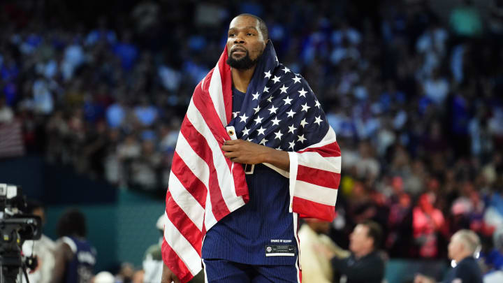 Aug 10, 2024; Paris, France; United States guard Kevin Durant (7) celebrates after defeating France in the men's basketball gold medal game during the Paris 2024 Olympic Summer Games at Accor Arena. Mandatory Credit: Rob Schumacher-USA TODAY Sports