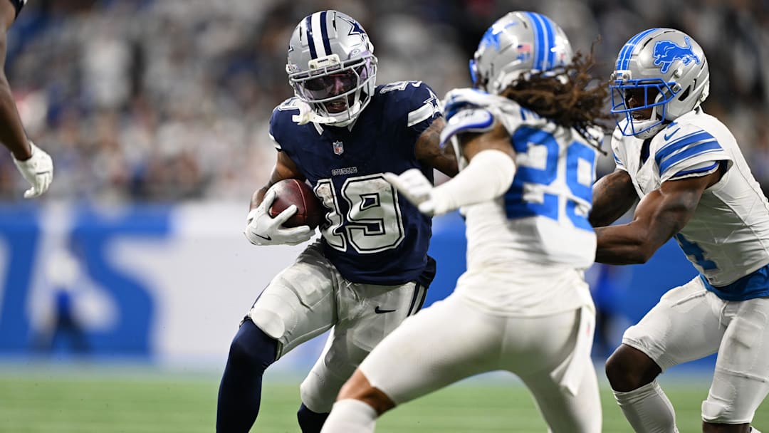 Dec 4, 2025; Detroit, Michigan, USA; Dallas Cowboys wide receiver Ryan Flournoy (19) runs against Detroit Lions cornerback D.J. Reed (4) and cornerback Avonte Maddox (29) during the second half at Ford Field. Mandatory Credit: Lon Horwedel-Imagn Images