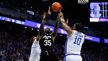 Jan 14, 2025; Lexington, Kentucky, USA; Texas A&M Aggies guard Manny Obaseki (35) goes to the basket against Kentucky Wildcats forward Brandon Garrison (10) during the first half at Rupp Arena at Central Bank Center. Mandatory Credit: Jordan Prather-Imagn Images