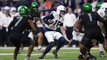Dec 7, 2024; Indianapolis, IN, USA; Penn State Nittany Lions quarterback Drew Allar (15) runs for a gain against the Oregon Ducks during the second quarter in the 2024 Big Ten Championship game at Lucas Oil Stadium. Mandatory Credit: Jordan Prather-Imagn Images