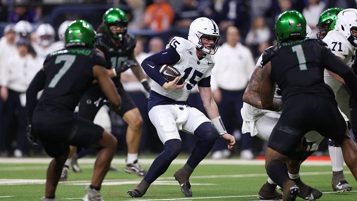 Dec 7, 2024; Indianapolis, IN, USA; Penn State Nittany Lions quarterback Drew Allar (15) runs for a gain against the Oregon Ducks during the second quarter in the 2024 Big Ten Championship game at Lucas Oil Stadium. Mandatory Credit: Jordan Prather-Imagn Images