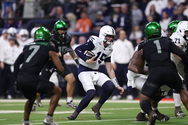 Penn State Nittany Lions quarterback Drew Allar (15) runs for a gain