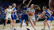 Council Bluffs St. Albert's Payton Johnsen drives to the basket against Newell-Fonda's Mareni Brabec during the 1A IGHSAU state basketball championship at Wells Fargo Arena on Saturday, March 8, 2025, in Des Moines.