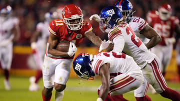 Nov 1, 2021; Kansas City, Missouri, USA; Kansas City Chiefs wide receiver Demarcus Robinson (11) runs with the ball as New York Giants cornerback Adoree' Jackson (22) and free safety Xavier McKinney (29) defend during the second half at GEHA Field at Arrowhead Stadium. Mandatory Credit: Jay Biggerstaff-USA TODAY Sports