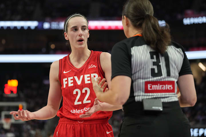 Indiana Fever guard Caitlin Clark argues with referee Amy Bonner during the second quarter against the Golden State Valkyries