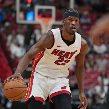 Apr 14, 2024; Miami, Florida, USA;  Miami Heat forward Jimmy Butler (22) brings the ball up the court against the Toronto Raptors during the first half at Kaseya Center. Mandatory Credit: Jim Rassol-Imagn Images