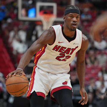 Apr 14, 2024; Miami, Florida, USA;  Miami Heat forward Jimmy Butler (22) brings the ball up the court against the Toronto Raptors during the first half at Kaseya Center. Mandatory Credit: Jim Rassol-Imagn Images