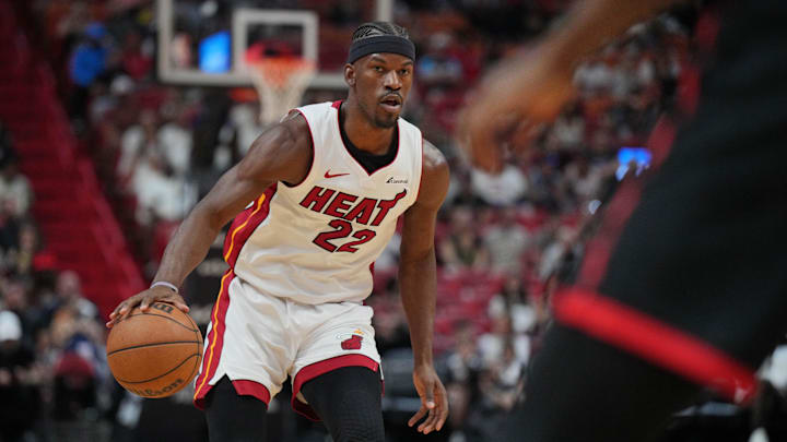 Apr 14, 2024; Miami, Florida, USA;  Miami Heat forward Jimmy Butler (22) brings the ball up the court against the Toronto Raptors during the first half at Kaseya Center. Mandatory Credit: Jim Rassol-Imagn Images