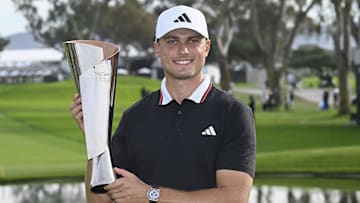 Feb 16, 2025; San Diego, California, USA; Ludvig Aberg holds up the trophy after winning The Genesis Invitational golf tournament at Torrey Pines. Mandatory Credit: Denis Poroy-Imagn Images