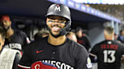 Jul 22, 2025; Los Angeles, California, USA; Minnesota Twins shortstop Carlos Correa (4) in the dugout after scoring a run against the Los Angeles Dodgers at Dodger Stadium. Mandatory Credit: Jayne Kamin-Oncea-Imagn Images