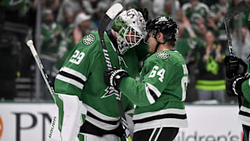 May 13, 2025; Dallas, Texas, USA; Dallas Stars goaltender Jake Oettinger (29) and center Mikael Granlund (64) celebrate the win over the Winnipeg Jets in game four of the second round of the 2025 Stanley Cup Playoffs at American Airlines Center. Mandatory Credit: Jerome Miron-Imagn Images