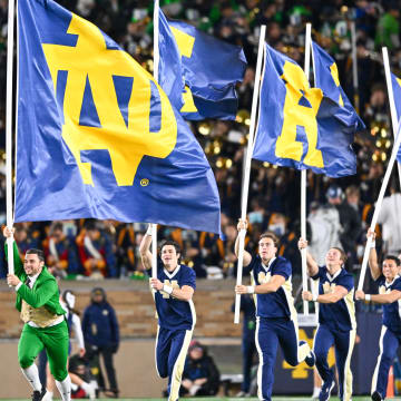 Oct 14, 2023; South Bend, Indiana, USA; The Notre Dame Leprechaun and cheerleaders celebrate after a Notre Dame touchdown in the third quarter against the USC Trojans at Notre Dame Stadium. Mandatory Credit: Matt Cashore-USA TODAY Sports