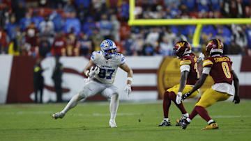 Nov 9, 2025; Landover, Maryland, USA; Detroit Lions tight end Sam LaPorta (87) runs for a gain past Washington Commanders safety Quan Martin (20) and cornerback Mike Sainristil (0) during the third quarter at Northwest Stadium. Mandatory Credit: Peter Casey-Imagn Images
