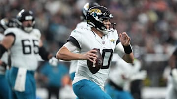 Dec 22, 2024; Paradise, Nevada, USA; Jacksonville Jaguars quarterback Mac Jones (10) scrambles against the Las Vegas Raiders in the first half at Allegiant Stadium. Mandatory Credit: Kirby Lee-Imagn Images