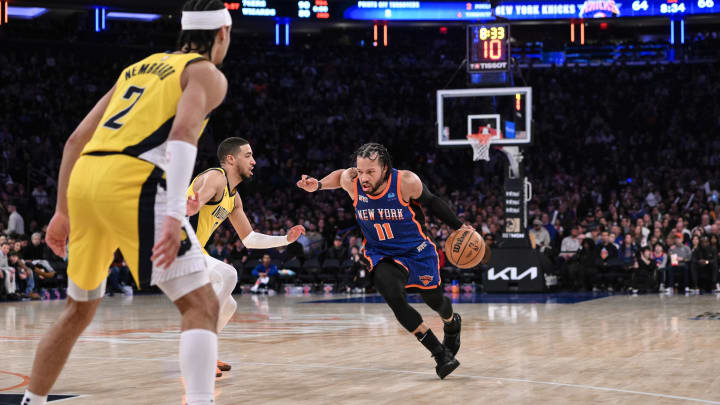 Feb 10, 2024; New York, New York, USA; New York Knicks guard Jalen Brunson (11) drives to the basket as Indiana Pacers guard Tyrese Haliburton (0) and Indiana Pacers guard Andrew Nembhard (2) defend during the third quarter at Madison Square Garden. Mandatory Credit: John Jones-USA TODAY Sports