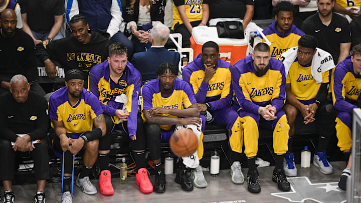 Apr 9, 2025; Dallas, Texas, USA; Los Angeles Lakers guard Luka Doncic (77) looks on from the team bench during the game between the Dallas Mavericks and the Los Angeles Lakers at American Airlines Center. Mandatory Credit: Jerome Miron-Imagn Images