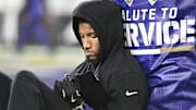 Baltimore Ravens cornerback Marlon Humphrey sits and reads a tablet before a game against the Cincinnati Bengals