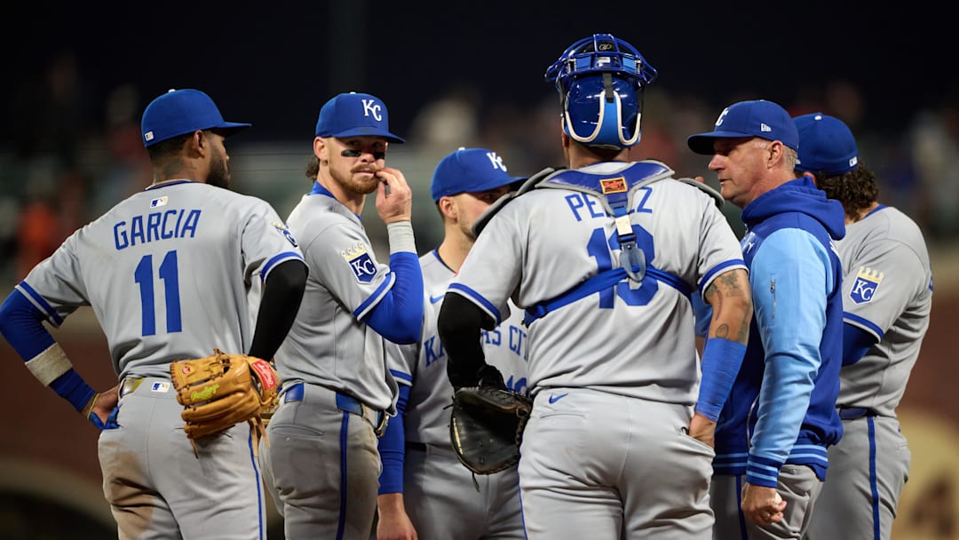 May 20, 2025; San Francisco, California, USA; Kansas City Royals manager Matt Quatraro (33) meets his team on the mound for a pitching change against the San Francisco Giants during the sixth inning at Oracle Park. Mandatory Credit: Robert Edwards-Imagn Images