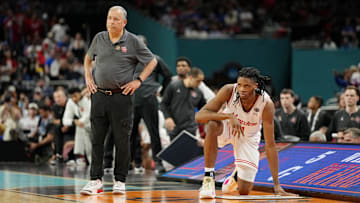 Houston Cougars head coach Kelvin Sampson and forward Joseph Tugler  look on against the Florida Gators during the second half of the national championship game of the Final Four of the 2025 NCAA Tournament at the Alamodome. 
