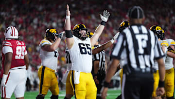 Oct 11, 2025; Madison, Wisconsin, USA; Iowa Hawkeyes offensive lineman Logan Jones (65) celebrates a touchdown in the first half against the Wisconsin Badgers at Camp Randall Stadium. Mandatory Credit: Ross Harried-Imagn Images