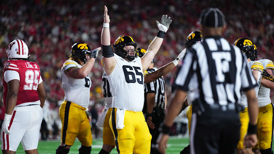 Oct 11, 2025; Madison, Wisconsin, USA; Iowa Hawkeyes offensive lineman Logan Jones (65) celebrates a touchdown in the first half against the Wisconsin Badgers at Camp Randall Stadium. Mandatory Credit: Ross Harried-Imagn Images