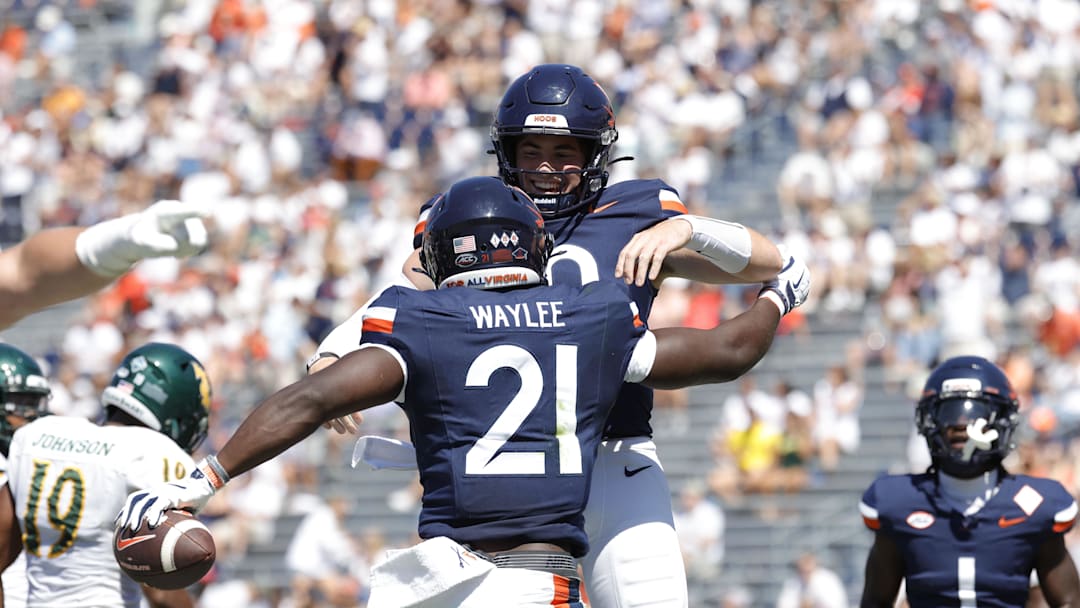Sep 13, 2025; Charlottesville, Virginia, USA; Virginia Cavaliers running back Harrison Waylee (21) celebrates with Cavaliers defensive back Ja'Son Prevard (10) after scoring a touchdown against the William & Mary Tribe during the second quarter at Scott Stadium. Mandatory Credit: Amber Searls-Imagn Images