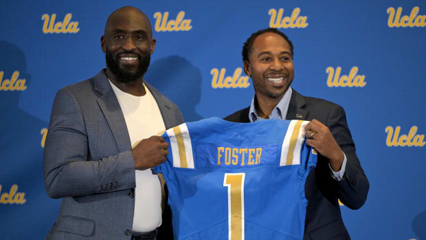 UCLA Bruins athletic director Martin Jarmond, right,  with new head football coach DeShaun Foster