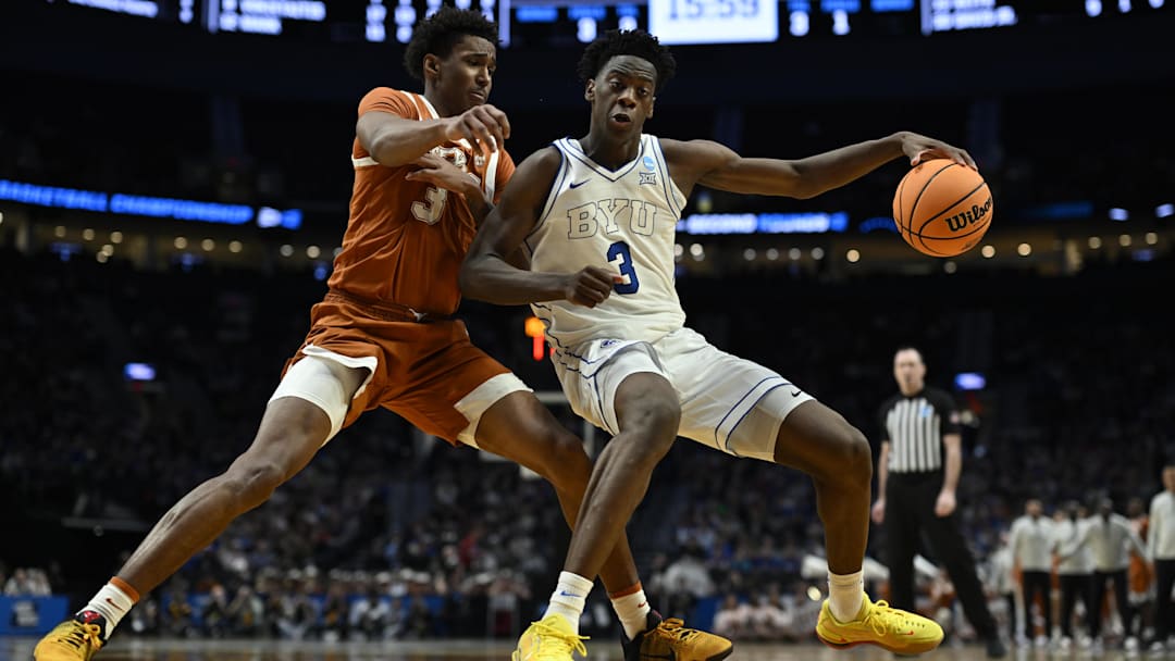 Mar 19, 2026; Portland, OR, USA; BYU Cougars forward AJ Dybantsa (3) dribbles against Texas Longhorns forward Dailyn Swain (3) in the second half during a first round game of the men's 2026 NCAA Tournament at Moda Center. Mandatory Credit: Troy Wayrynen-Imagn Images Mar 19, 2026; Portland, OR, USA; BYU Cougars forward AJ Dybantsa (3) dribbles against Texas Longhorns forward Dailyn Swain (3) in the second half during a first round game of the men's 2026 NCAA Tournament at Moda Center. Mandatory Credit: Troy Wayrynen-Imagn Images