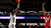 Cincinnati Bearcats guard-forward Rayvon Griffith (3) hits a shot over Ohio State Buckeyes forward Devin Royal (21) in the first half of a basketball scrimmage between Cincinnati Bearcats and Ohio State Buckeyes at Fifth Third Arena in Cincinnati on Friday, Oct. 18, 2024.