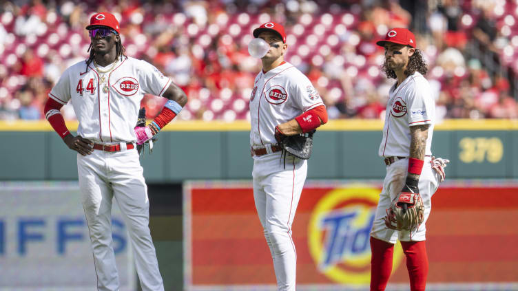 Cincinnati Reds infielders Elly De La Cruz, Joey Votto, Jonathan India