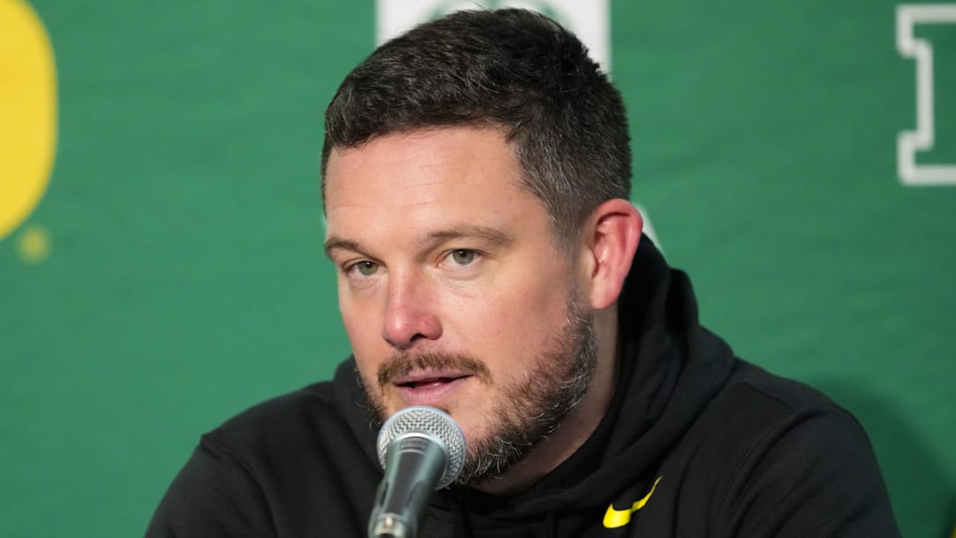 Nov 16, 2024; Madison, Wisconsin, USA;  Oregon Ducks head coach Dan Lanning talks to the media during the post game press conference following the game against the Wisconsin Badgers at Camp Randall Stadium. Mandatory Credit: Jeff Hanisch-Imagn Images