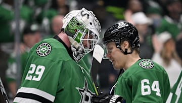 Apr 28, 2025; Dallas, Texas, USA; Dallas Stars goaltender Jake Oettinger (29) and center Mikael Granlund (64) celebrate the win over the Colorado Avalanche in game five of the first round of the 2025 Stanley Cup Playoffs at American Airlines Center. Mandatory Credit: Jerome Miron-Imagn Images