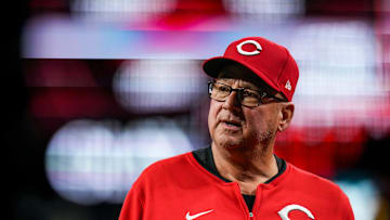 Cincinnati Reds manager Terry Francona (77) returns to the dugout after checking on center fielder TJ Friedl (29) in the third inning of the MLB interleague game between the Cincinnati Reds and the Chicago White Sox at Great American Ball Park in Cincinnati on Tuesday, May 13, 2025. The score was 0-0 after three innings.
