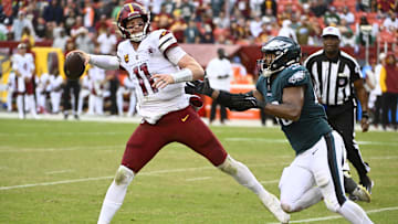 Sep 25, 2022; Landover, Maryland, USA; Philadelphia Eagles linebacker Patrick Johnson (48) pressures Washington Commanders quarterback Carson Wentz (11) during the second half at FedExField. Mandatory Credit: Brad Mills-Imagn Images