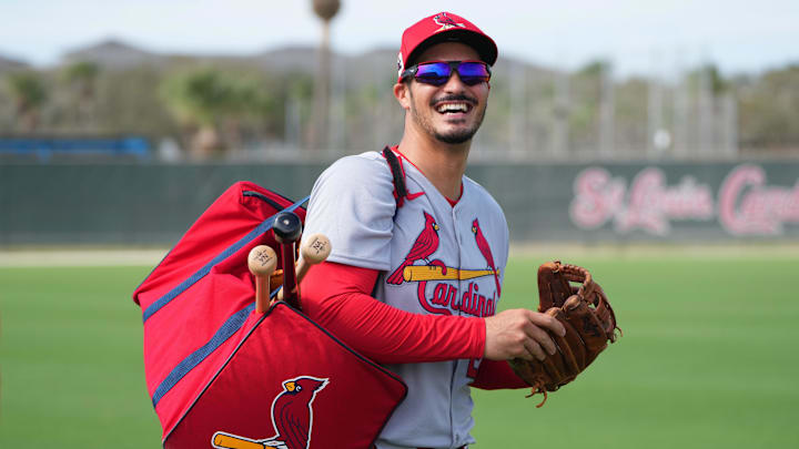 Feb 17, 2025; Jupiter, FL, USA;  St. Louis Cardinals third base Nolan Arenado (28) laughs as he heads off to a workout station at spring training.