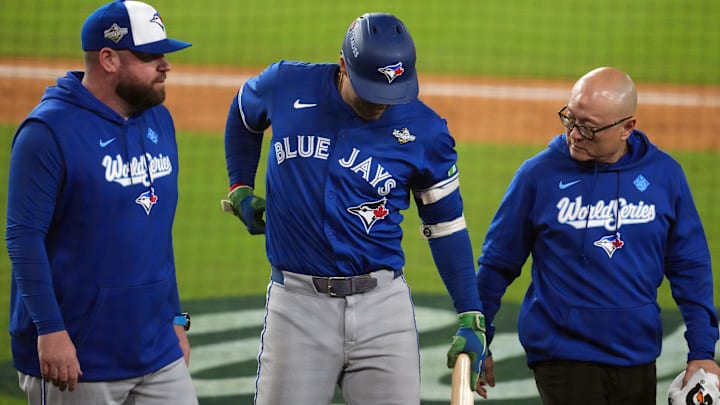 Oct 27, 2025; Los Angeles, California, USA; Toronto Blue Jays right fielder George Springer (4) leaves the game after an apparent injury in the seventh inning against the Los Angeles Dodgers during game three of the 2025 MLB World Series at Dodger Stadium. Mandatory Credit: Kirby Lee-Imagn Images