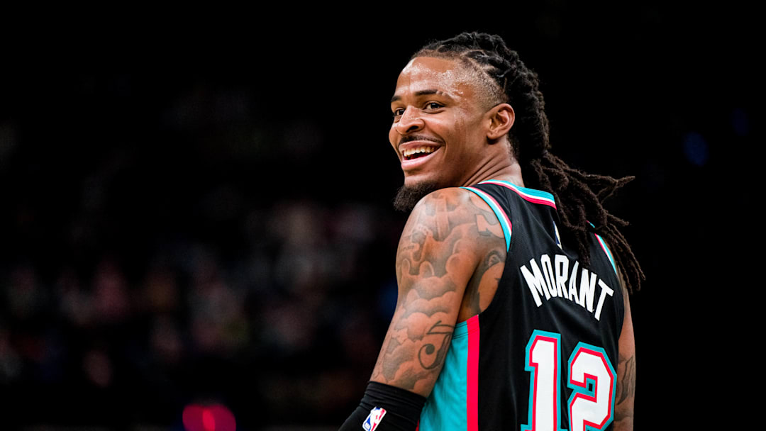 Dec 12, 2025; Memphis, Tennessee, USA; Memphis Grizzlies point guard Ja Morant (12) smiles at the Utah Jazz bench after forcing a turnover in the second half at FedExForum. Mandatory Credit: Matthew Smith-Imagn Images
