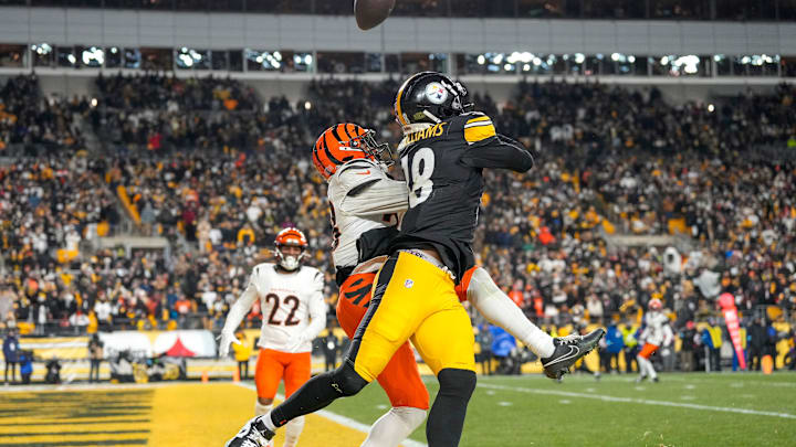 Cincinnati Bengals cornerback DJ Ivey (38) breaks up a pass to Pittsburgh Steelers wide receiver Mike Williams (18) in the end zone n the fourth quarter of the NFL Week 18 game between the Pittsburgh Steelers and the Cincinnati Bengals at Acrisure Stadium in Pittsburgh on Saturday, Jan. 4, 2025. The Bengals won 19-17 to finish the regular season at 9-8. Cincinnati Bengals cornerback DJ Ivey (38) breaks up a pass to Pittsburgh Steelers wide receiver Mike Williams (18) in the end zone n the fourth quarter of the NFL Week 18 game between the Pittsburgh Steelers and the Cincinnati Bengals at Acrisure Stadium in Pittsburgh on Saturday, Jan. 4, 2025. The Bengals won 19-17 to finish the regular season at 9-8.